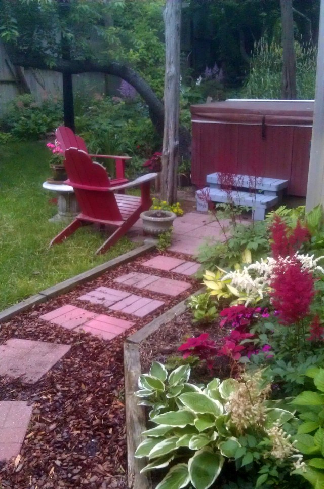 Rounding the corner into the back yard, the walk continues to the hot tub patio, passing another one of my favorite little beds along the way. 